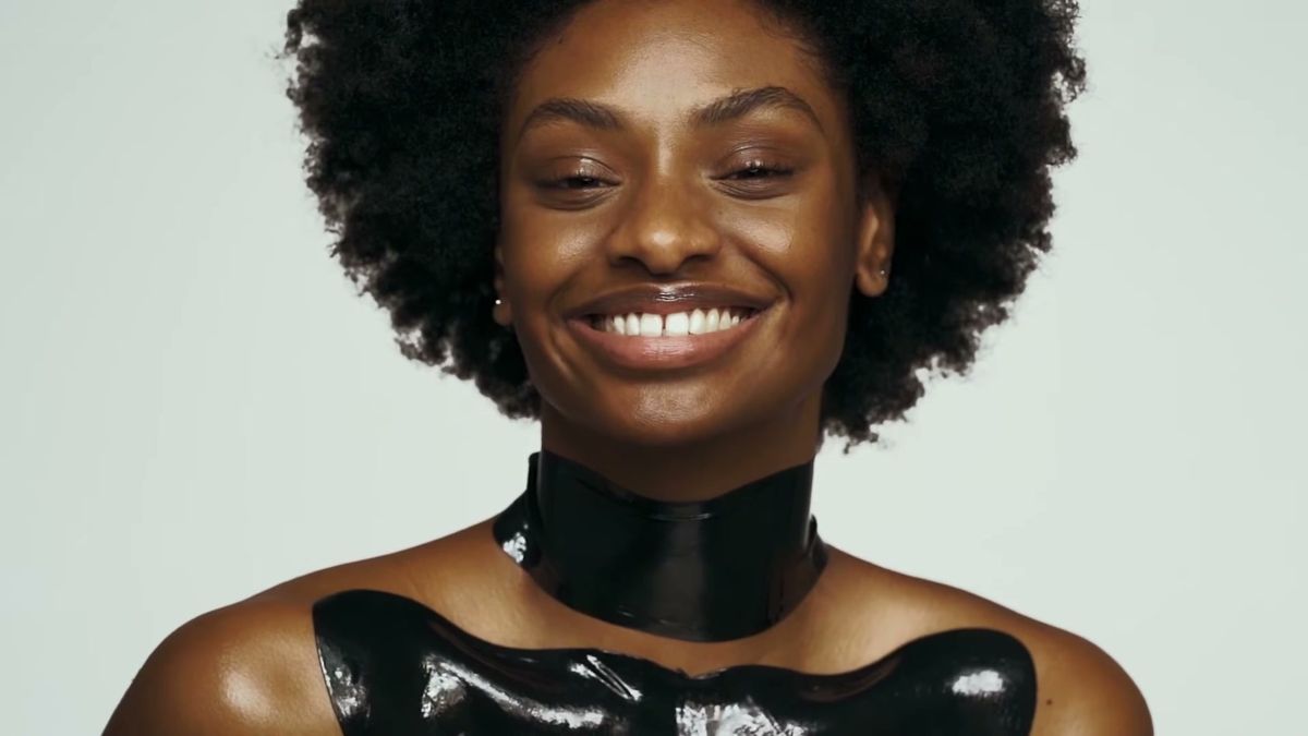 Model smiling with glowing skin after the 111SKIN mask