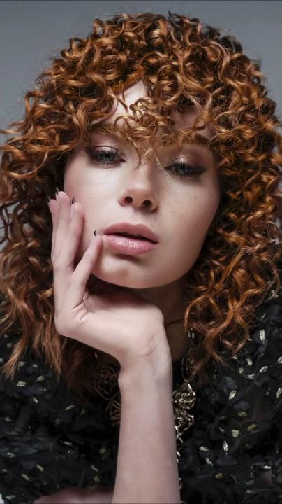 Beauty portrait with copper curls and freckles, retouched with texture kept