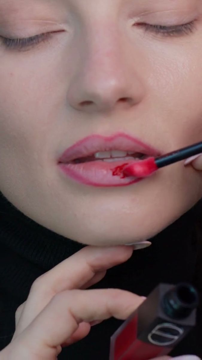 Lip colour applied with a brush in close-up, pores and fine lines visible