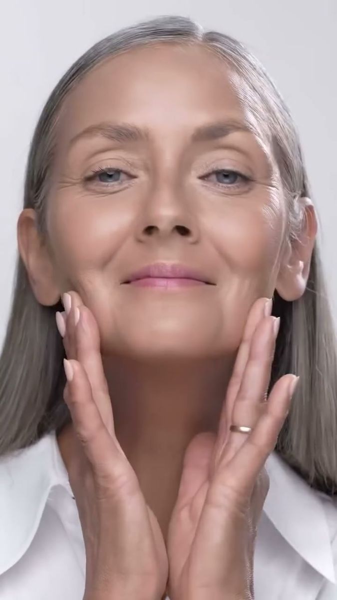 Model with grey hair framing her face with her hands, Code8 Day to Night Foundation film