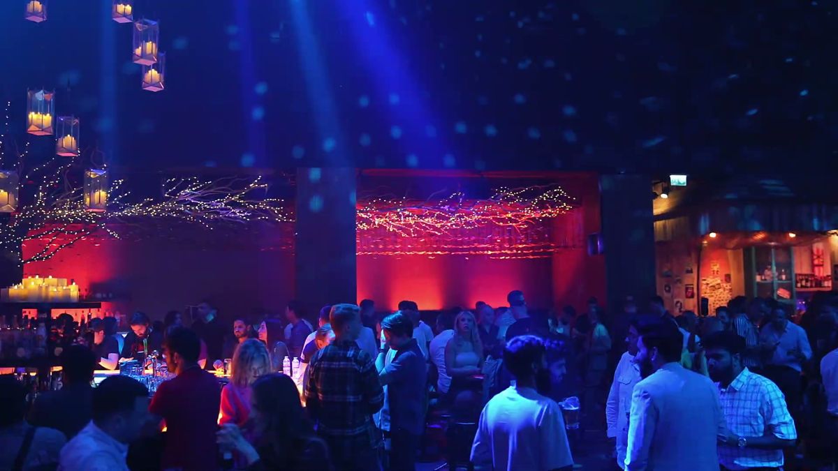 Crowded dance floor under red and blue lights at the Affiliate World x Shinz closing party, Bla Bla Dubai