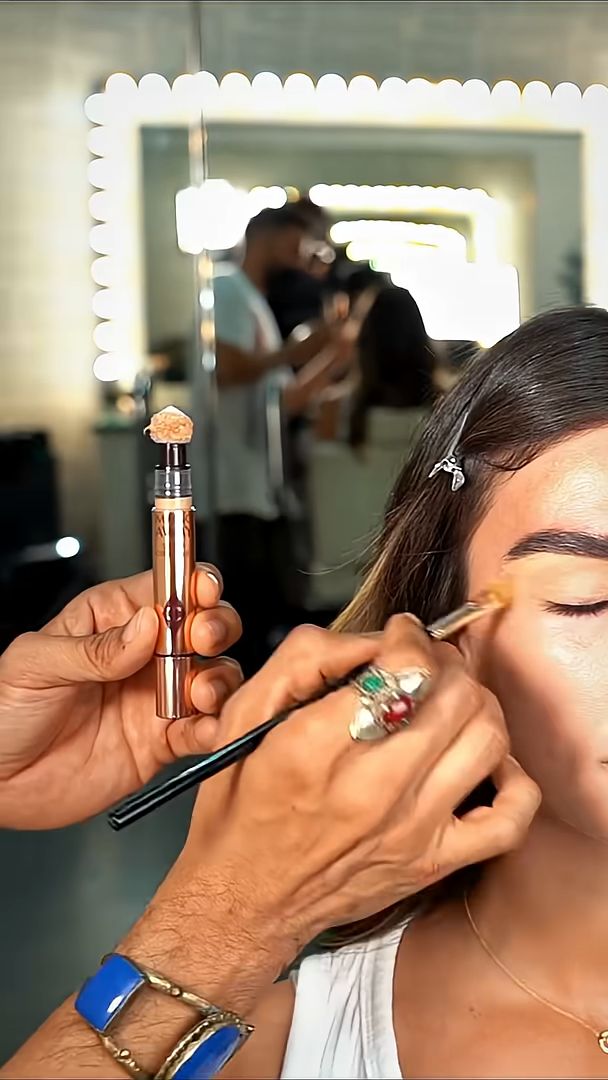 Make-up being applied at the mirror on the Charlotte Tilbury Eid shoot