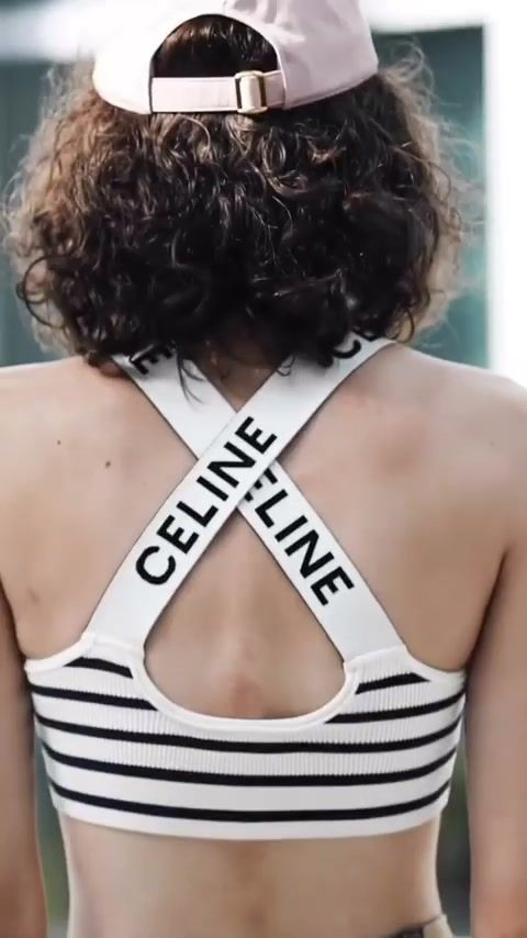 Back detail of a striped Celine logo top and cap