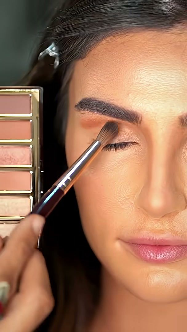 Make-up artist applying eyeshadow with a brush