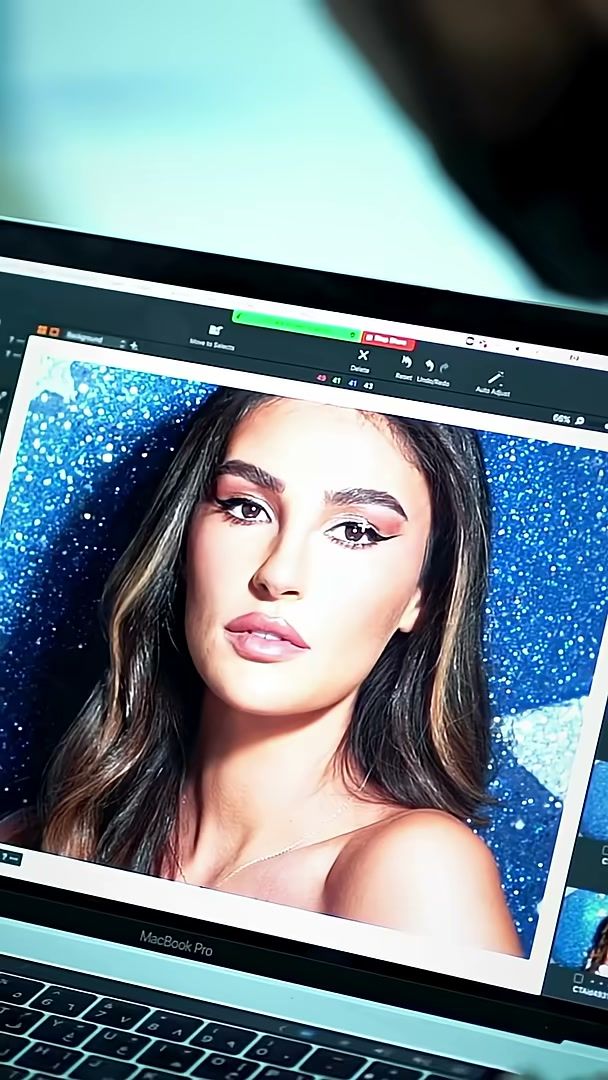 Laptop on set showing a tethered beauty frame against the starry backdrop