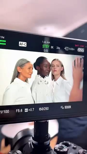Camera monitor showing three models in white shirts on the Code8 foundation shoot