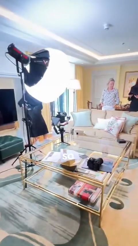 Hotel suite set with one light in a large round modifier and a gimbal, Kelly Rutherford x Code8 behind the scenes