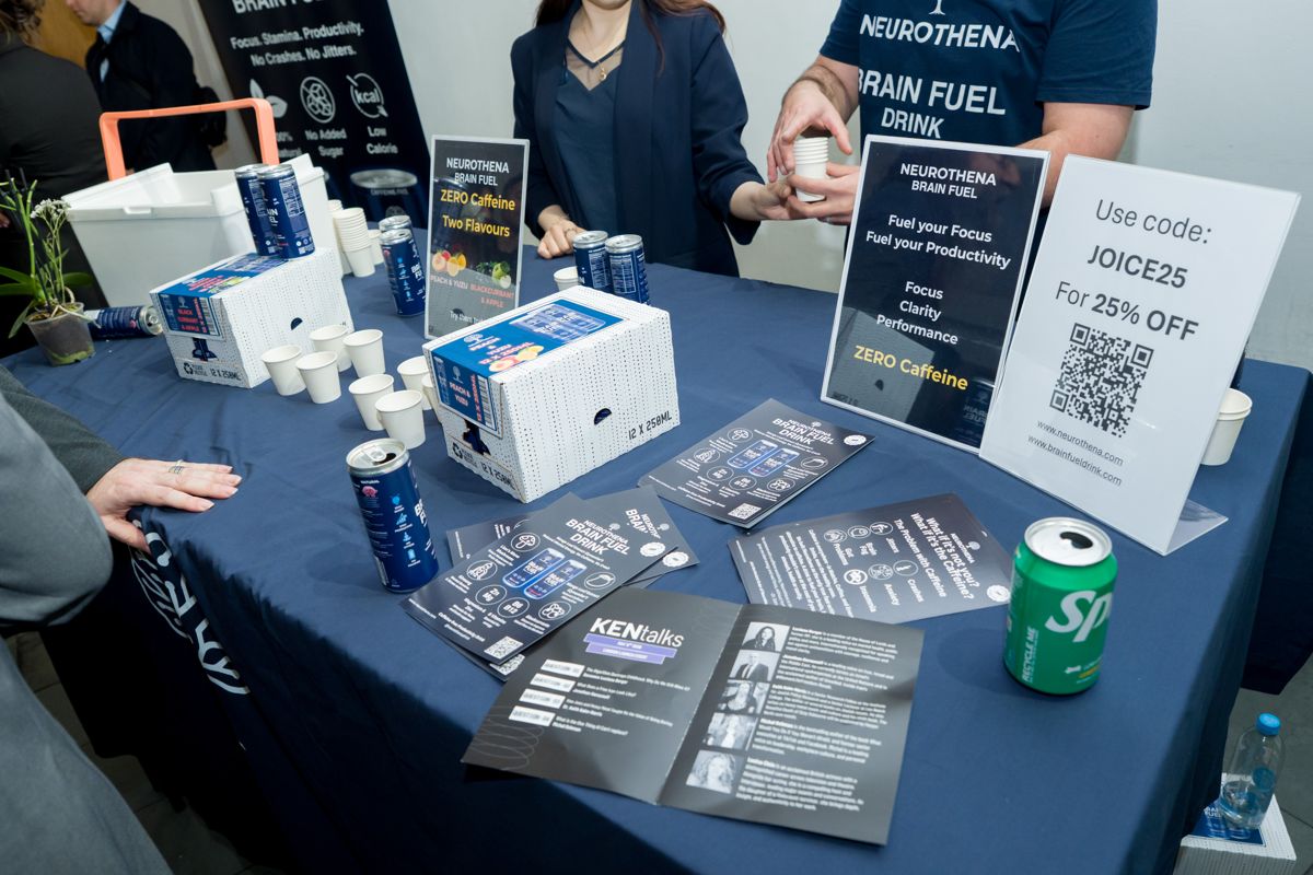 Printed KEN Talks programme and sponsor drinks on a table in the foyer at artsdepot, London