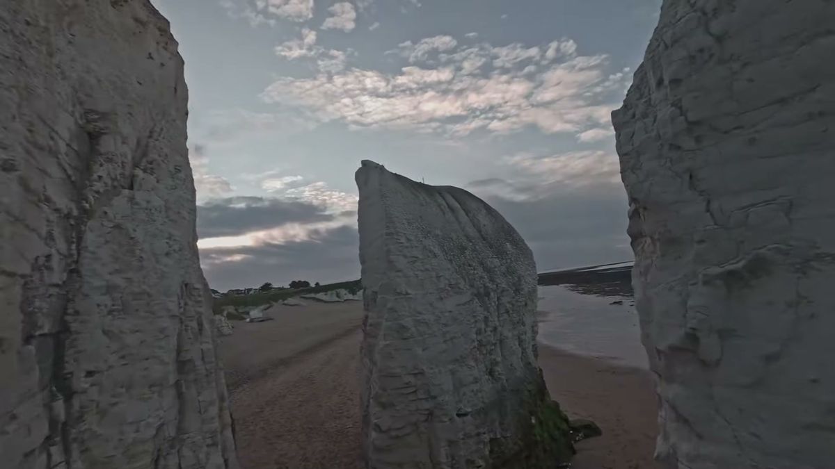 Horizontal FPV frame of chalk sea stacks with the vertical crop area marked