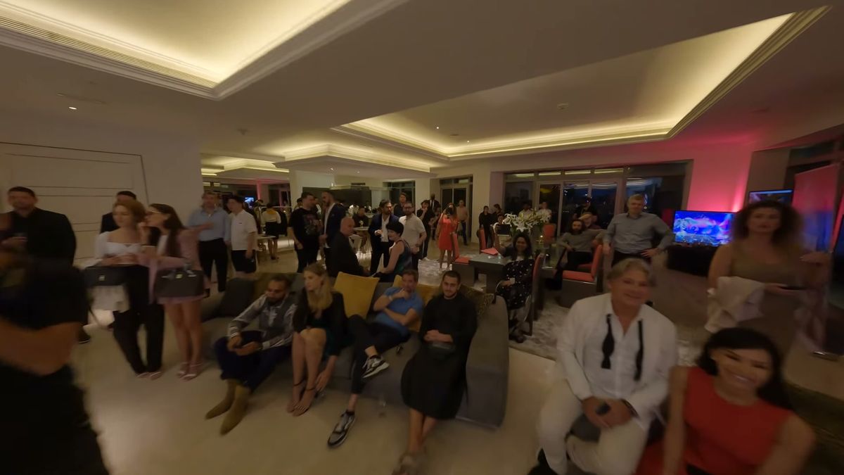 FPV drone frame of a full lounge of guests at an event in a Dubai tower