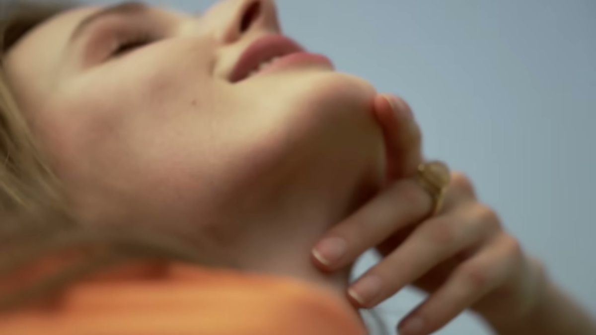 Close-up of skin and a gold ring in warm light, Damas Jewellery