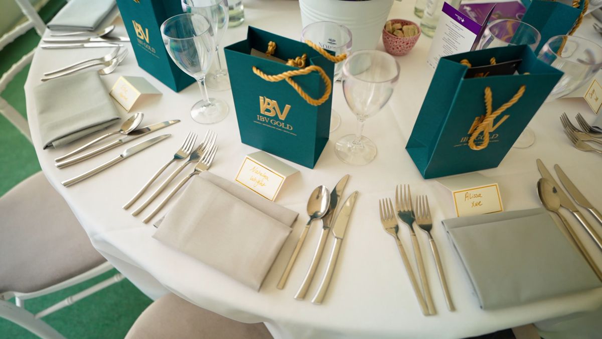 IBV Gold gift bags laid on hospitality tables before guests arrive at Polo in the Park, London
