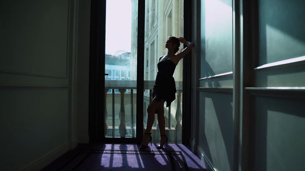 Model in silhouette at a tall window, L'Officiel Baltic film at Palazzo Versace Dubai