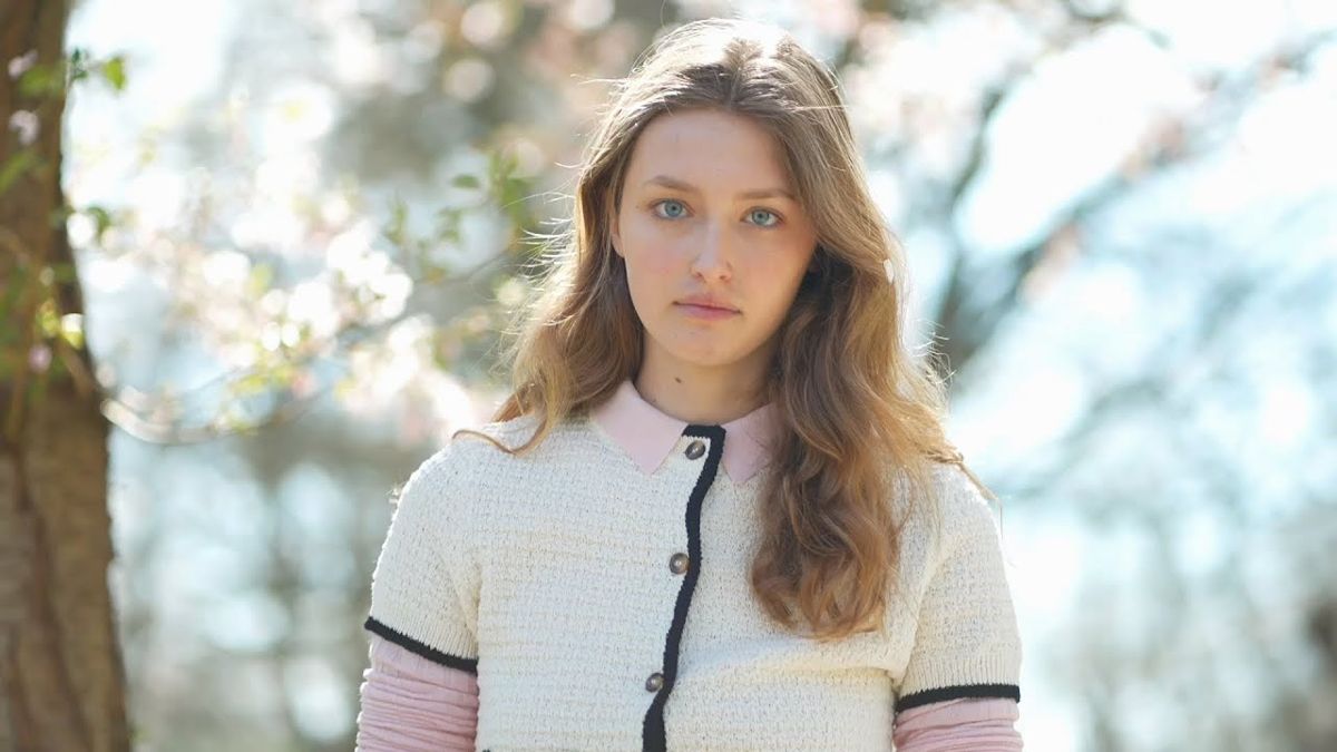 Alice for Linden Staub, portrait under spring blossom, still from the film C'est Alice