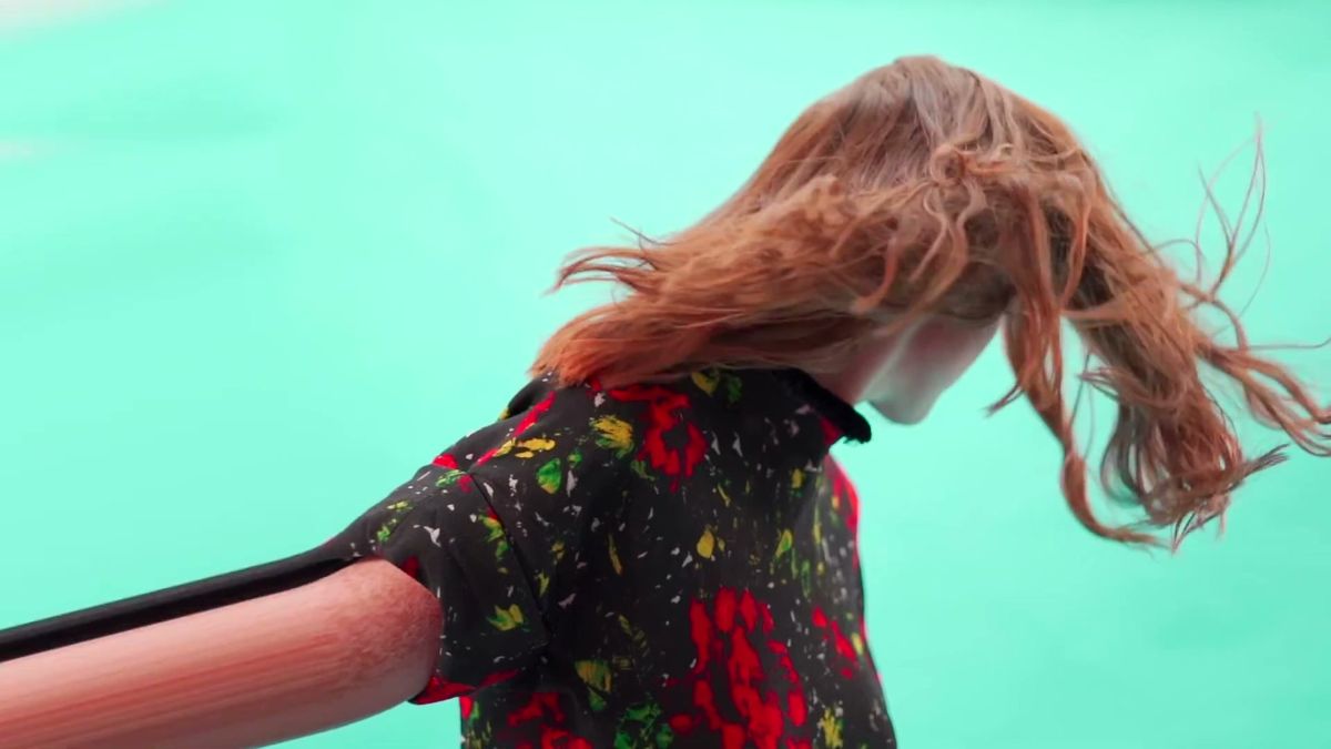 Rose Leslie on a turquoise set with hair in motion, 1883 Magazine RISQUE film