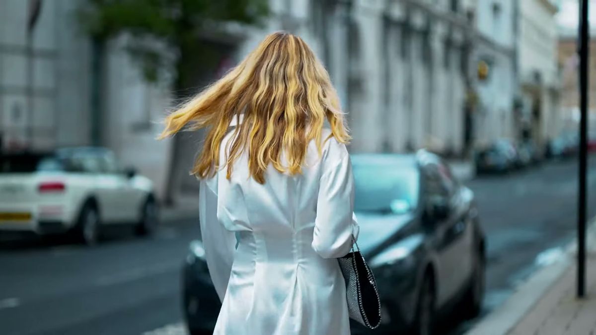 Model in a white shirt dress turning on a London street, Staccato fashion film