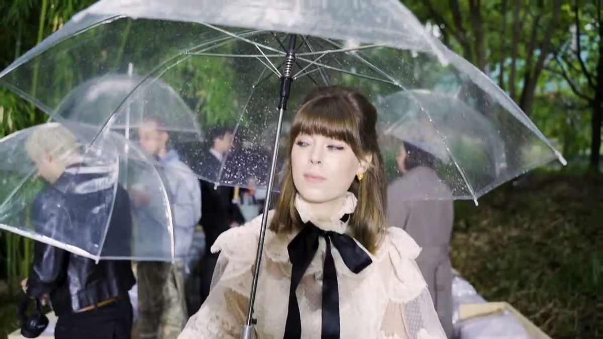 Model walking with a clear umbrella at the Lanvin show in Paris
