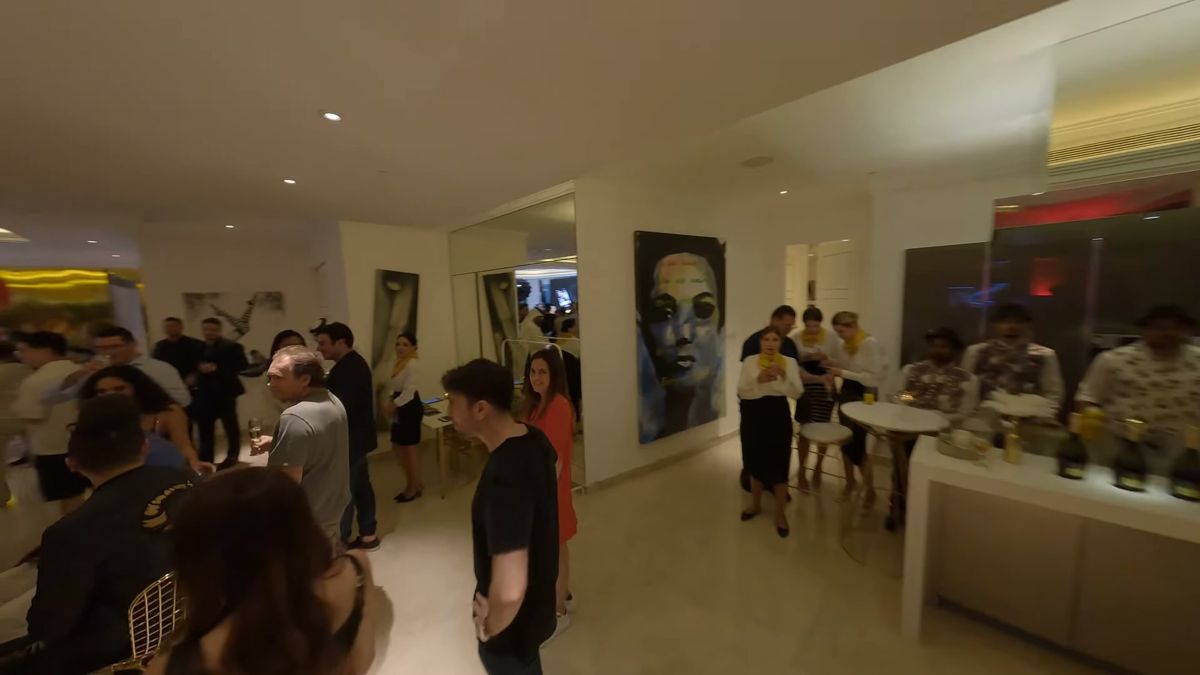 FPV flight through guests and artwork at an indoor event in Dubai