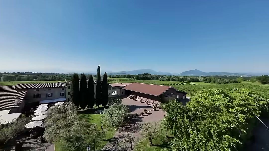 FPV shot over a wedding venue among vineyards and cypress trees in Verona