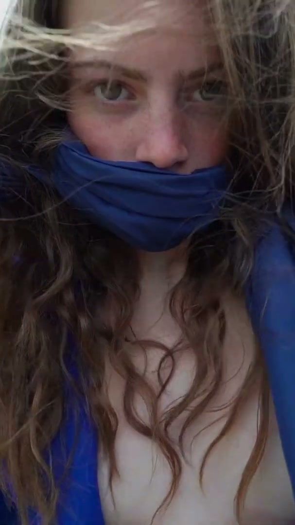 Model wrapped in blue fabric in an open field, 1883 Magazine fashion film