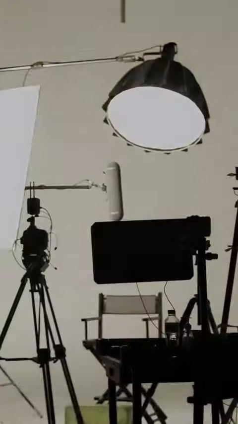 Studio set for the ALIF by DAMAS shoot with a large softbox, camera, monitor and a director's chair