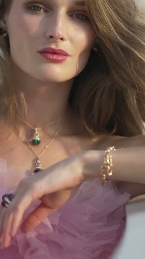Model in pink tulle wearing a gemstone necklace, ring and bracelet on the Damas x Dome shoot