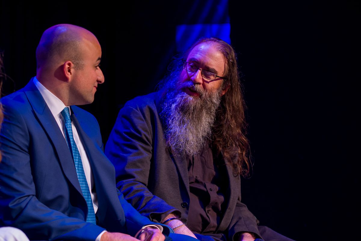 Two panellists listening to a question on stage at KEN Talks