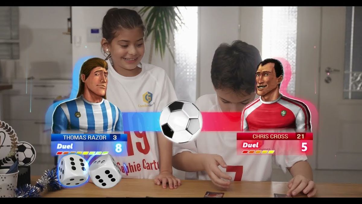 Two children playing the KickOff football board game with animated player cards and dice composited over the live action