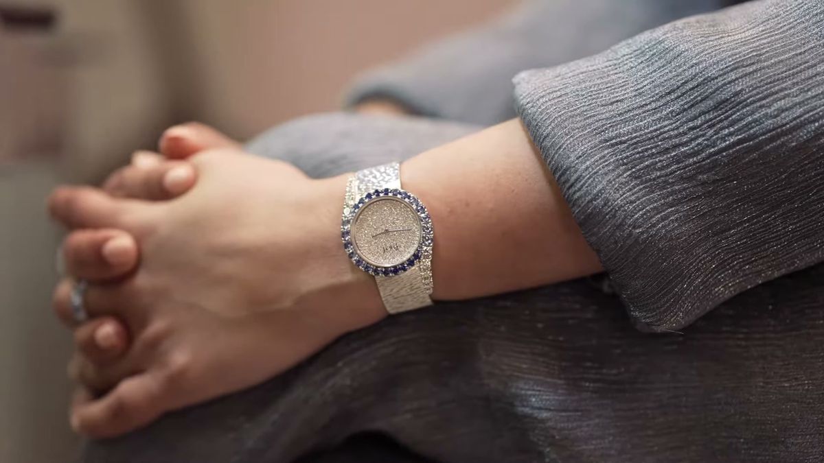 Diamond watch on a wrist with hands clasped, a detail shot from a Vogue Arabia shoot in Dubai