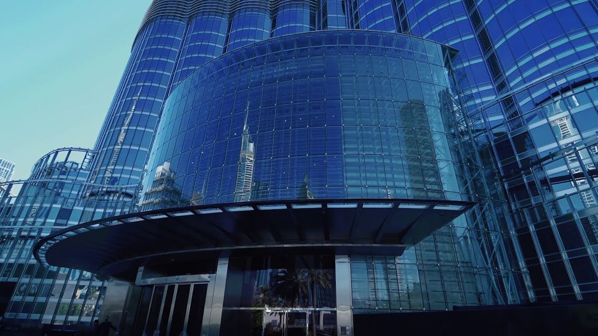 Low angle on the glass entrance at the base of Burj Khalifa, home of Armani Hotel Dubai