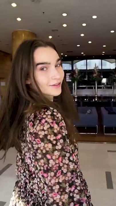 Model turning to camera in the lobby of Catalonia Barcelona Plaza hotel