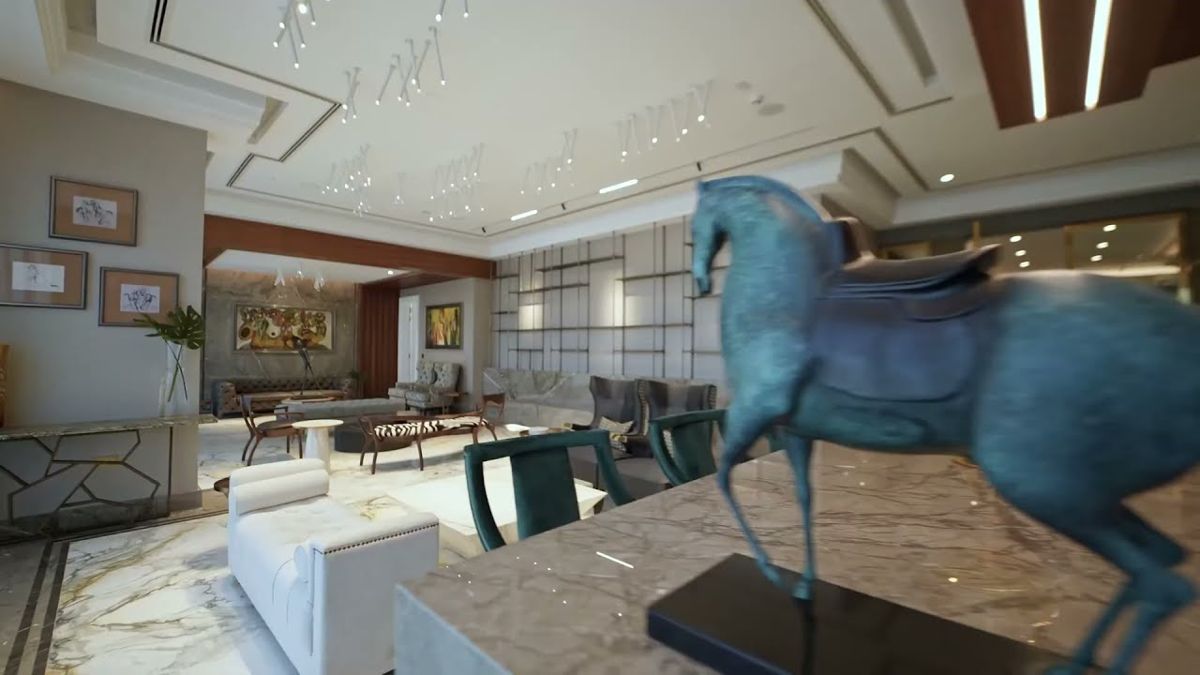 Living room in a Dubai luxury property framed past a bronze horse sculpture in the foreground