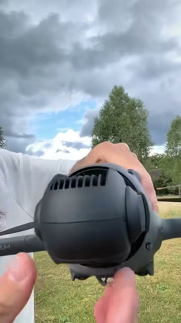 DJI Mavic 4 Pro held up to show its triple camera on the Infinity Gimbal