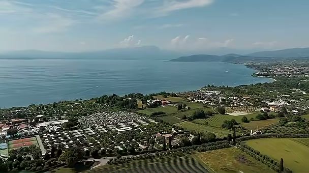 DJI Mini 4 Pro aerial over the countryside and a lake near Verona