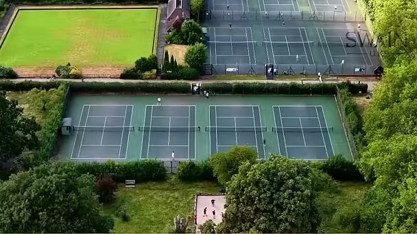 Top-down aerial of tennis courts and a bowling green filmed on the Mavic 4 Pro