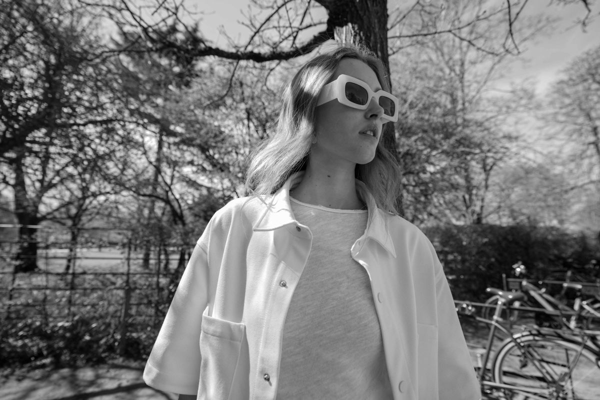 Black and white frame of Alice in sunglasses and a white jacket in a Richmond park, Linden Staub test