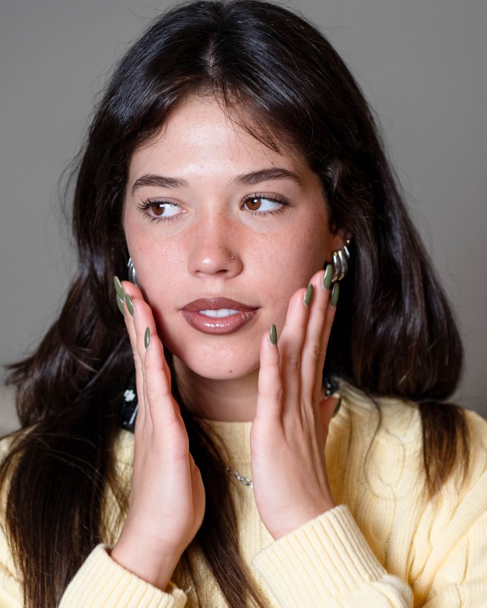 Seacra red algae campaign portrait, model with her hands on her face