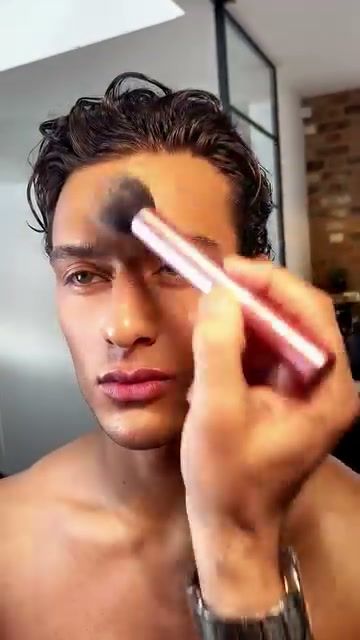 Make-up artist applying product to a model for Seacra content