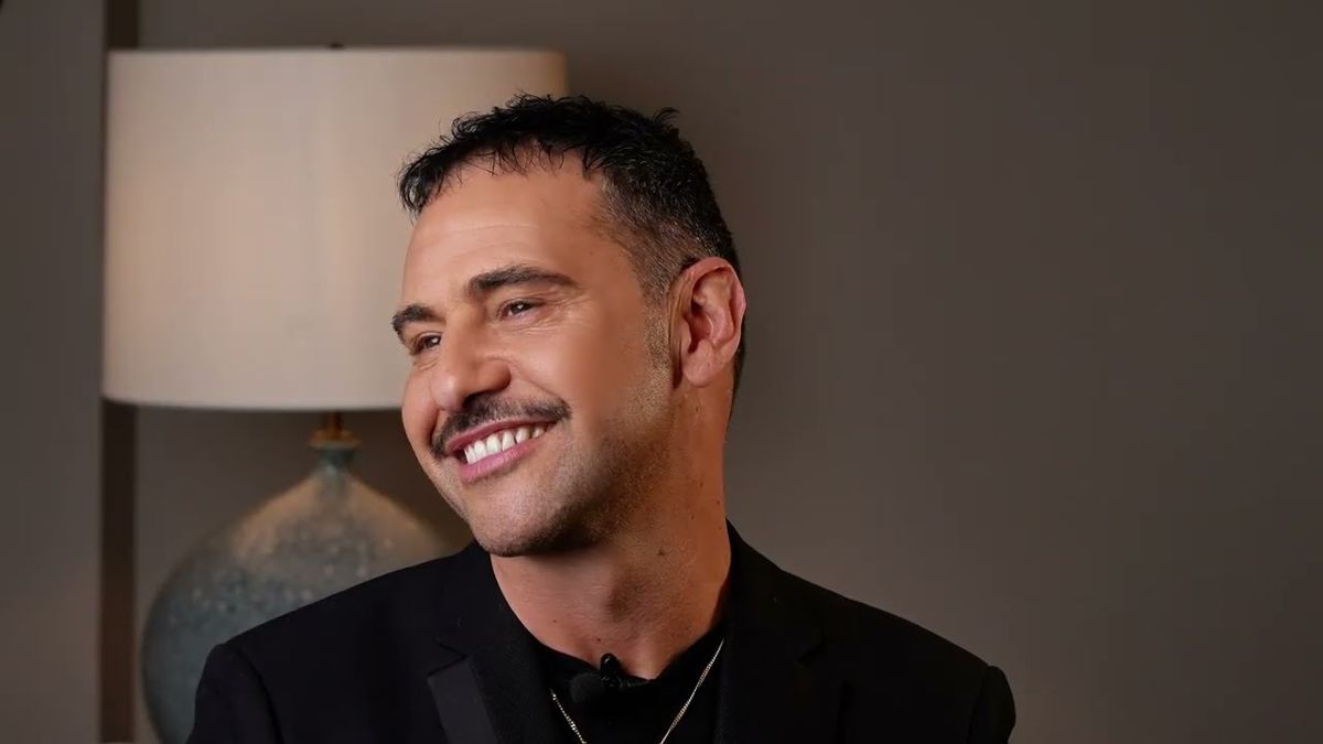 Makeup artist smiling in a seated expert video for Seacra