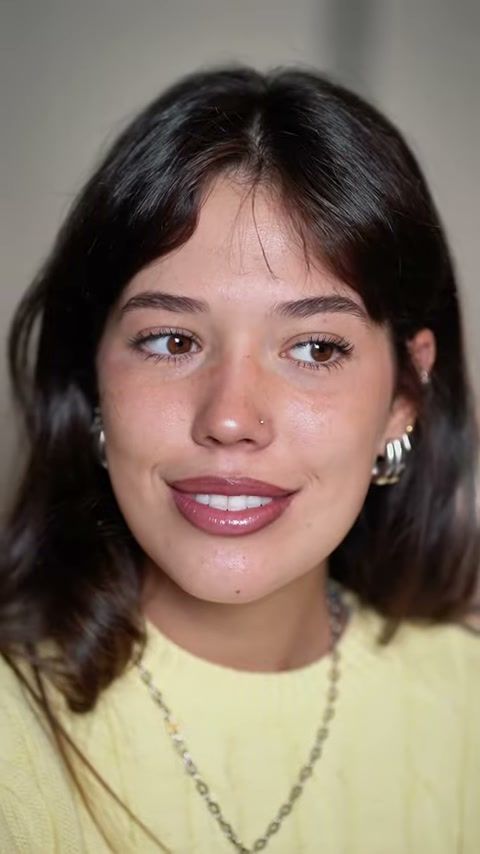 Close-up of a young woman with clean, glowing skin after her routine