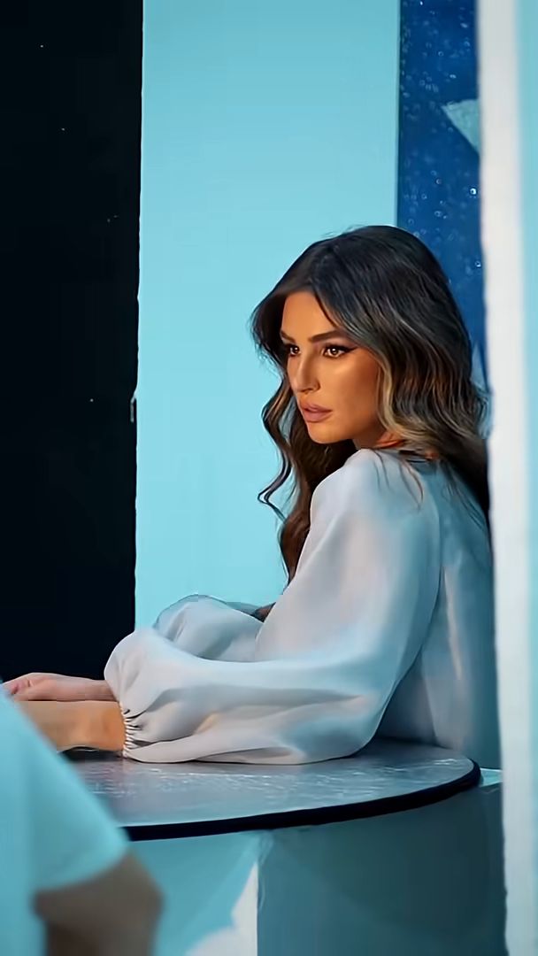 Eid campaign portrait against a starry blue backdrop, vertical frame from the Charlotte Tilbury shoot in Dubai
