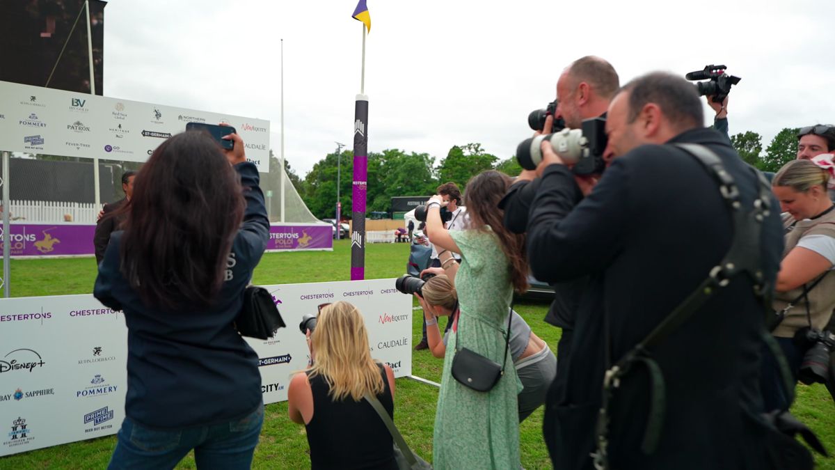 Press photographers working in front of the sponsor wall at Polo in the Park