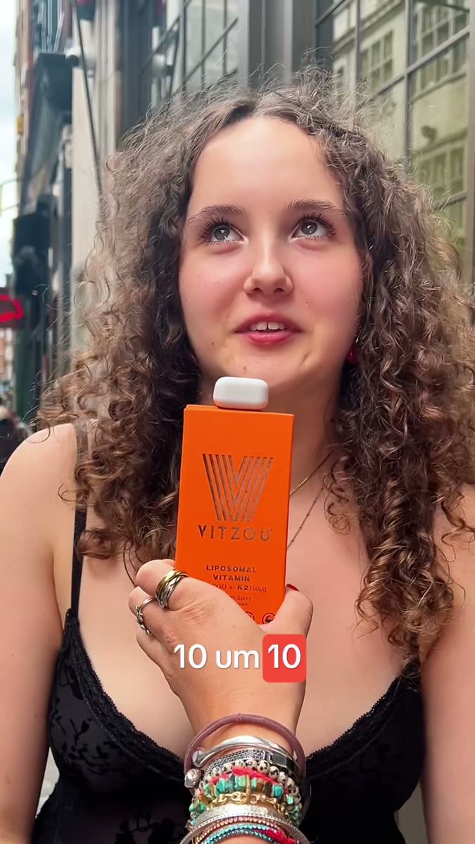 Street interview in London, a woman holding the product with on-screen captions