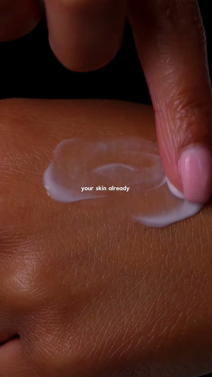Skincare cream texture on skin with an on-screen caption