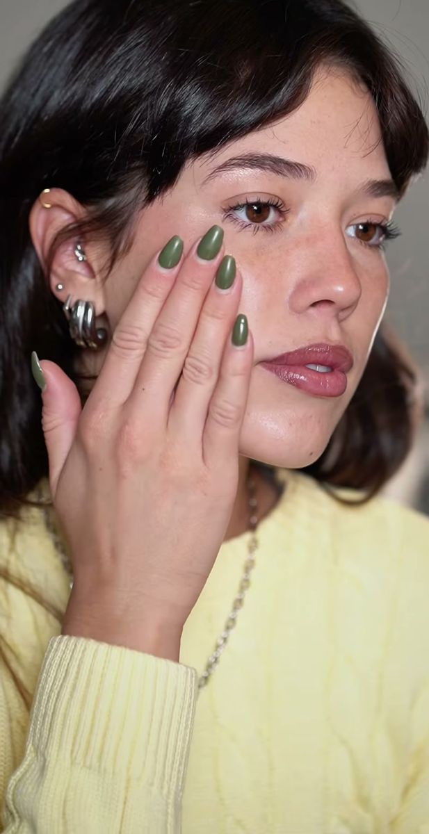 UGC-style skincare routine frame of a woman pressing product into her cheek at home