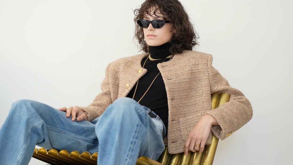 Model in a Celine look in a clean, minimal studio set in Dubai