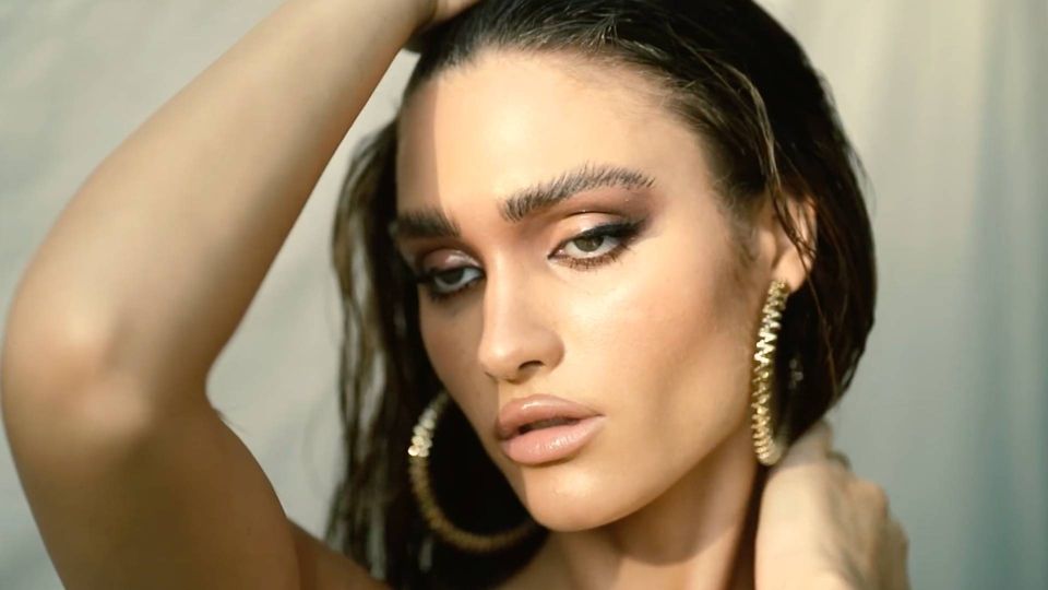 Beauty portrait with gold hoop earrings, jewellery editorial in Dubai