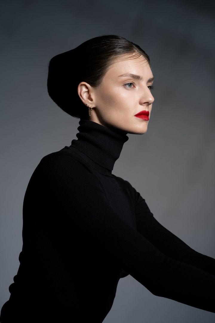 Slicked bun profile, red lip beauty photoshoot Dubai