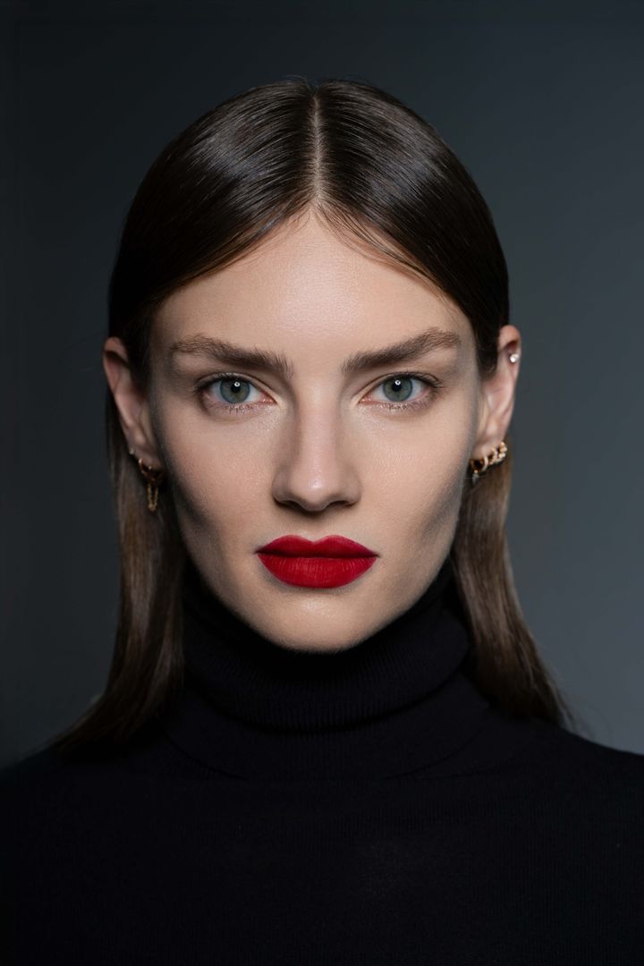 Close beauty portrait wearing Rouge Dior On Stage Ink transfer-proof matte red lipstick, Dubai